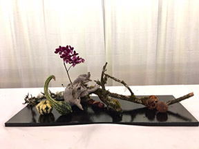 Morimono arrangement with driftwood and orchid, chestnuts and various dried squash